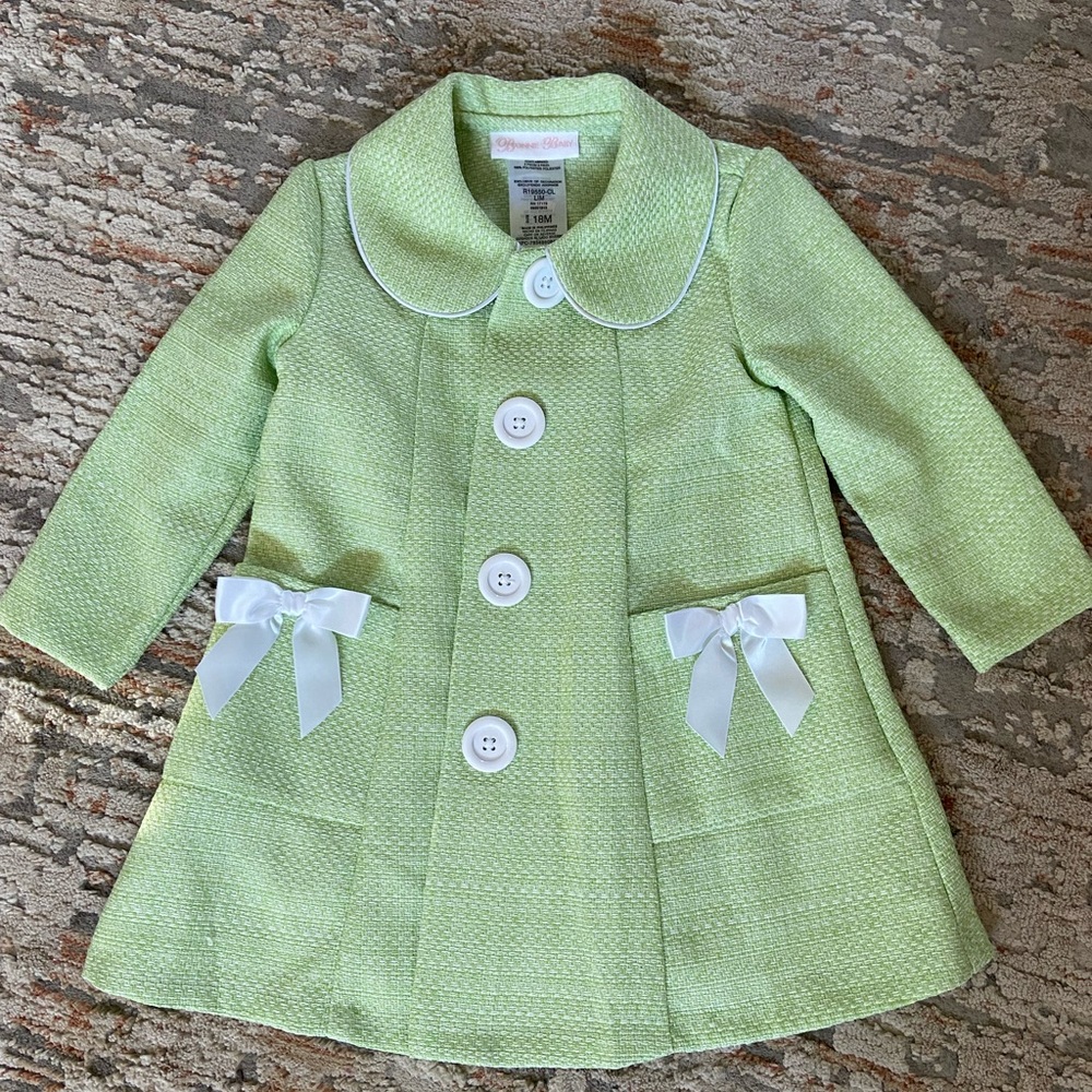 Adorable mint green Easter coat with white bows and buttons. It’s light-weight.
